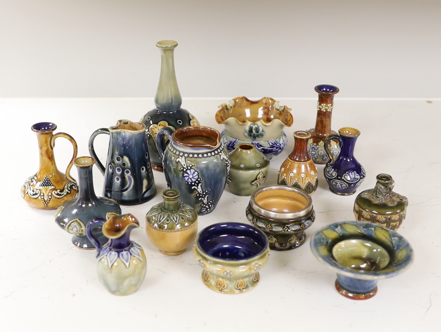 Sixteen miniature Doulton Stoneware items including bowls, vases, jugs, etc., tallest, 14.5cm